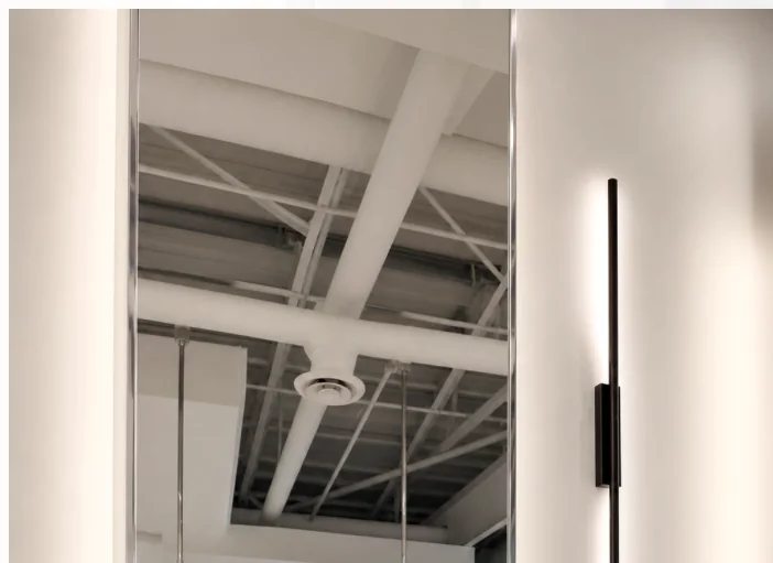 Architectural mirror and light inside Forever Young